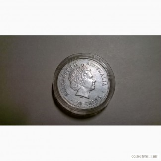 Продам серебряную монету 50 центов